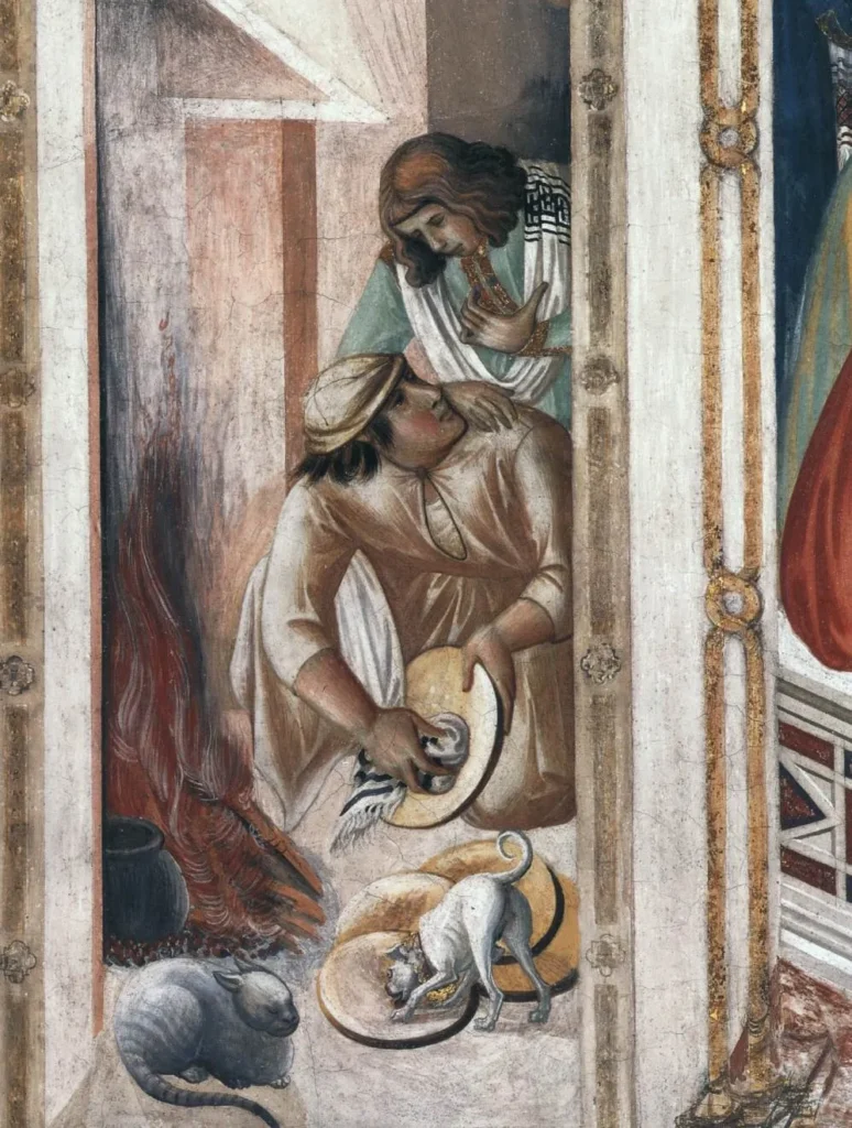 Detalle de la pintura La Última Cena, de Pietro Lorenzetti, donde un gato y un perro aparecen integrados en una escena de la vida medieval.